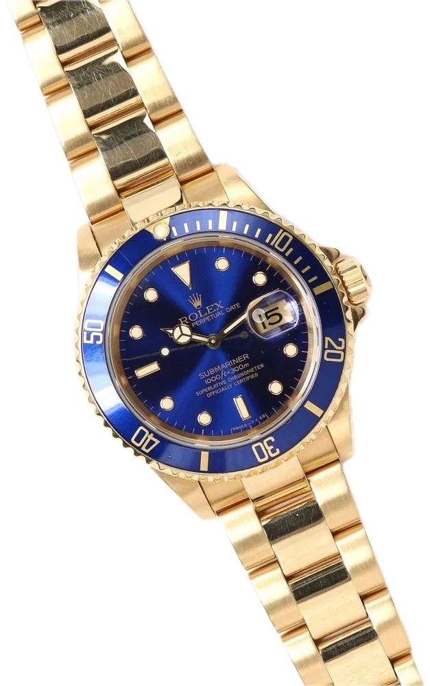 A yellow-gold dive watch with a purple-blue dial and matching bezel on a gold bracelet.